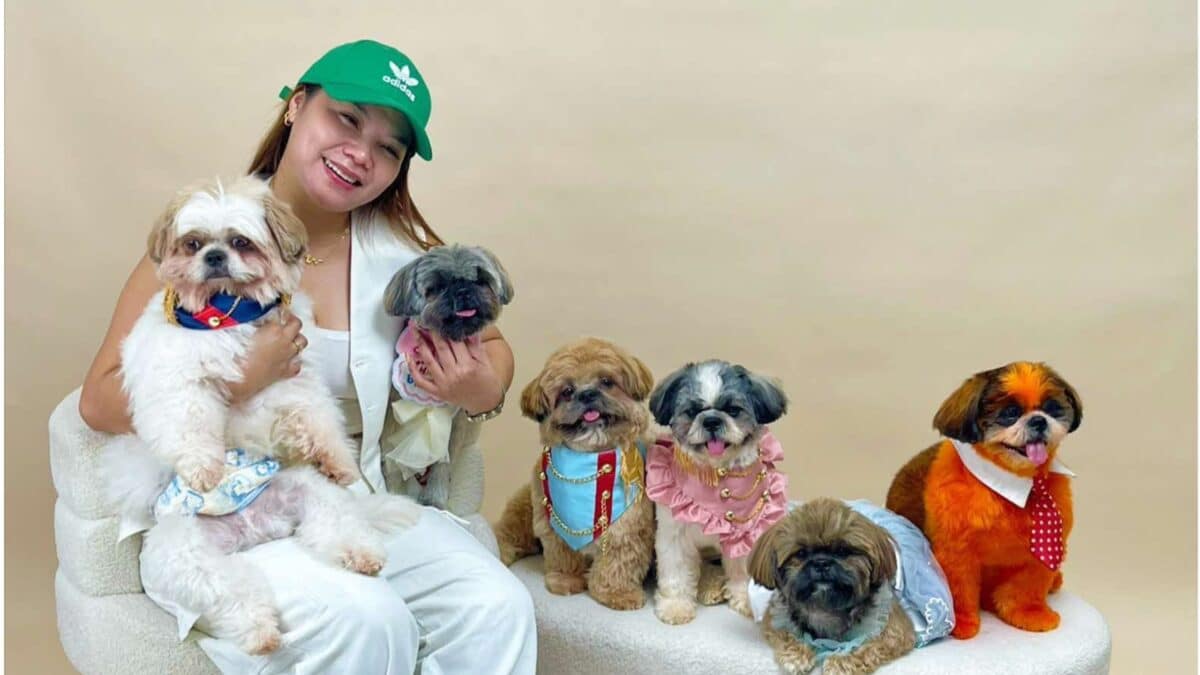 Photo shows fur parent Mamiraz holding Panda Pandesal with her other fur babies in a photoshoot.